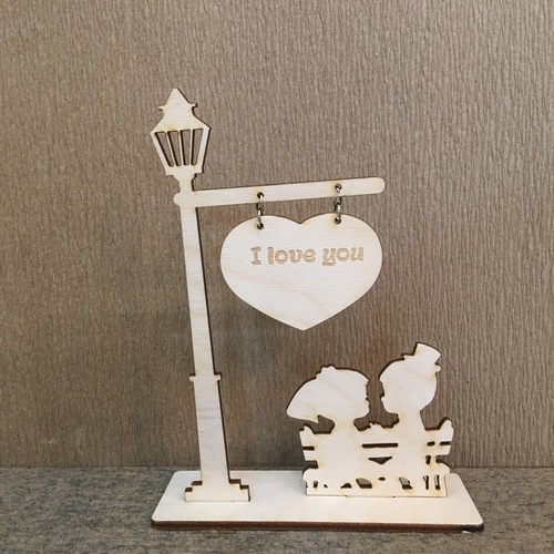 Wooden couple at night with engraved text