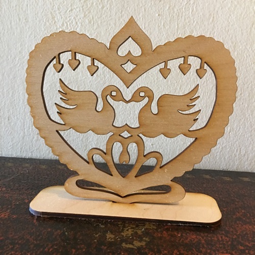 Wooden birds in heart